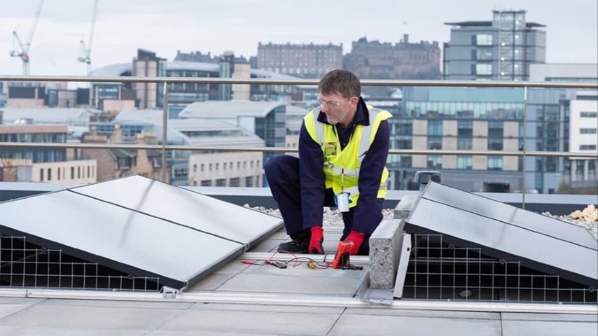 Roofworker in Edinburgh on top of building